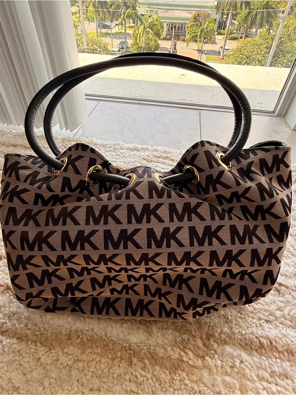 Michael Kors Brown and Black MK Signature Tote with Tassel Charm